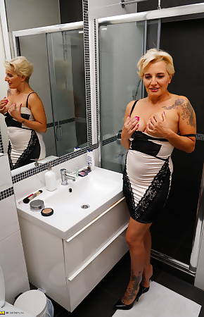 Naughty housewife getting extra wet under the shower