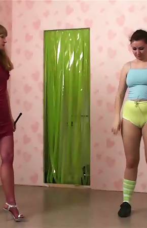 Jumping fitness bitch of a lesdom trainer with a cane