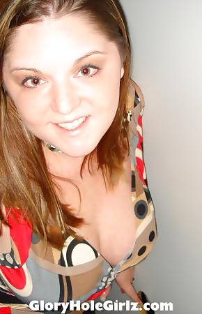 Busty Regina On Her Knees Sucking Dicks in The Gloryhole