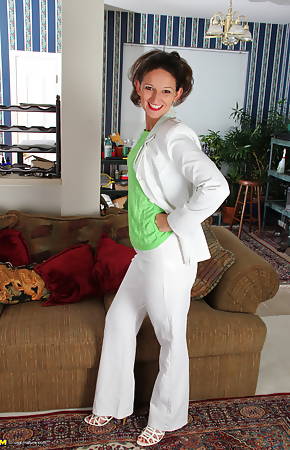 Cute American housewife stripping at home