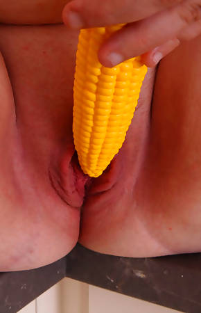 Young chubby slut bouncing on top of a corn dildo