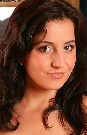 Dark haired beauty Gabriela spreads her ass cheeks