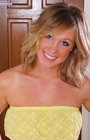 Perky breasted Ashley Jones rubs her shaved pussy