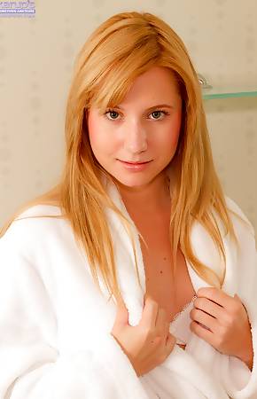 Beautiful Odette drops her white bath robe to the floor