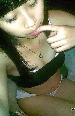 Kinky Asian teen stripping naked while selfshooting