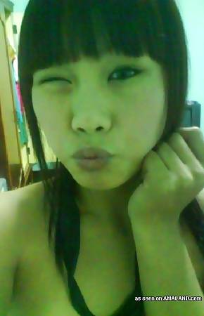 Petite Asian chick teasing and selfshooting naked
